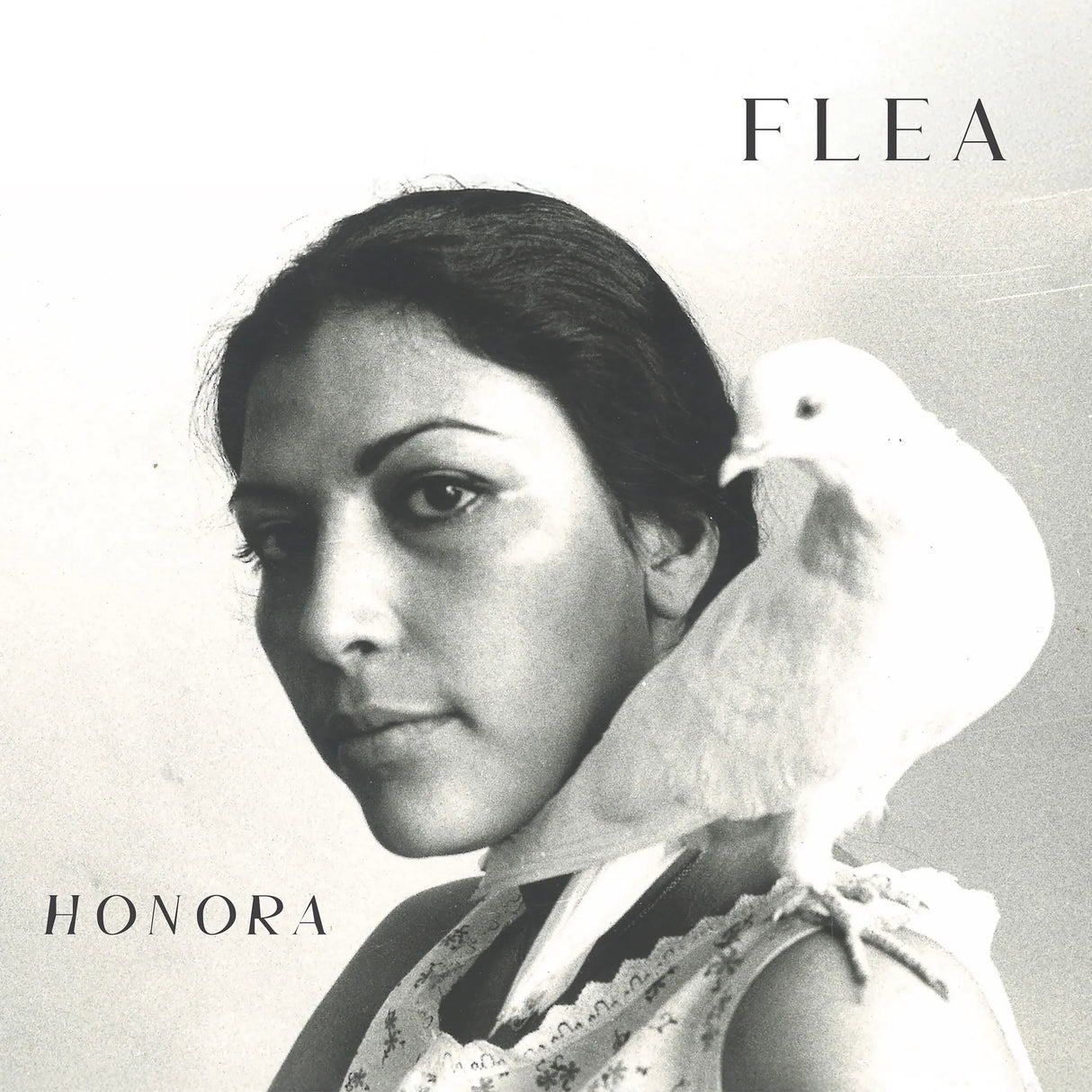 Album cover with a woman's portrait and a dove, featuring the name 'Flea' and 'Honora'.