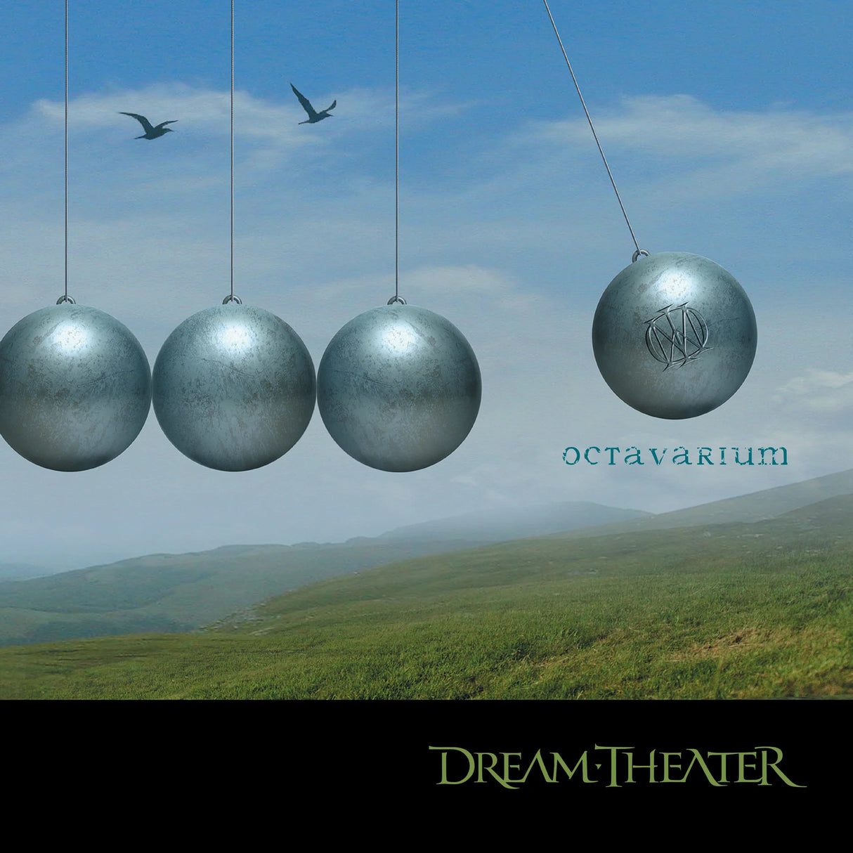 Album cover with metallic spheres and 'Dream Theater' branding against a scenic background