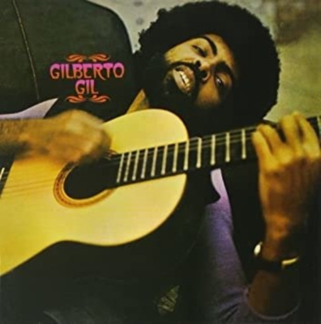Album cover featuring a person playing an acoustic guitar with a transparent gold vinyl record sleeve.