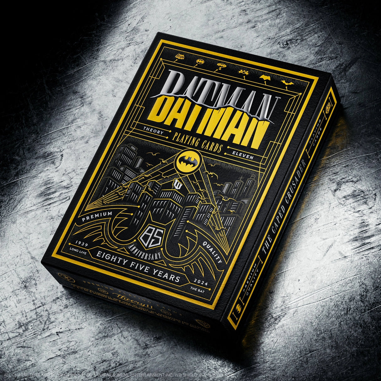 Batman playing cards box on a textured surface