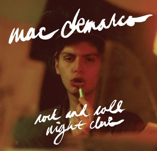 Album cover with a person holding a microphone, text 'mac deMarco', and 'rock and roll night club'.