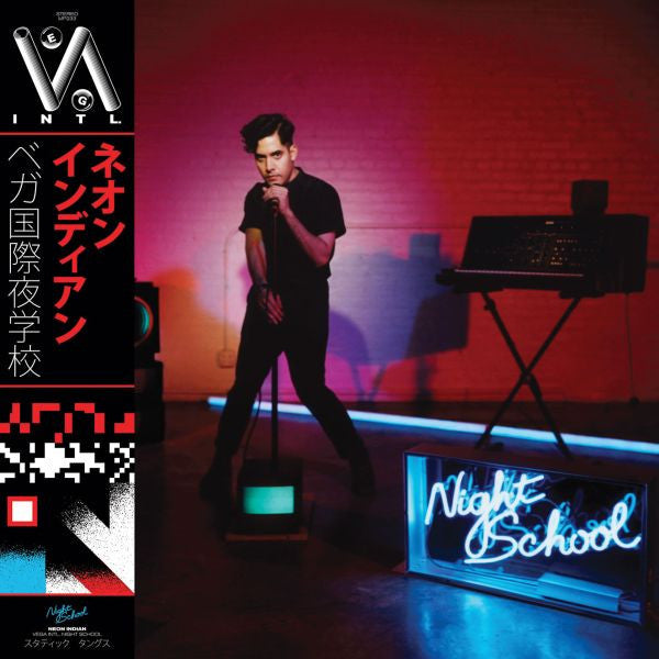 Person in a black outfit standing in front of a neon sign with 'Night School' on a dark background