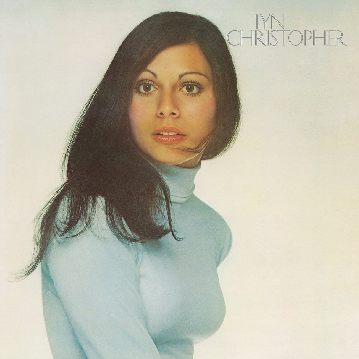 Album cover with a person wearing a light blue turtleneck against a plain background, featuring the text 'LYN CHRISTOPHER'.