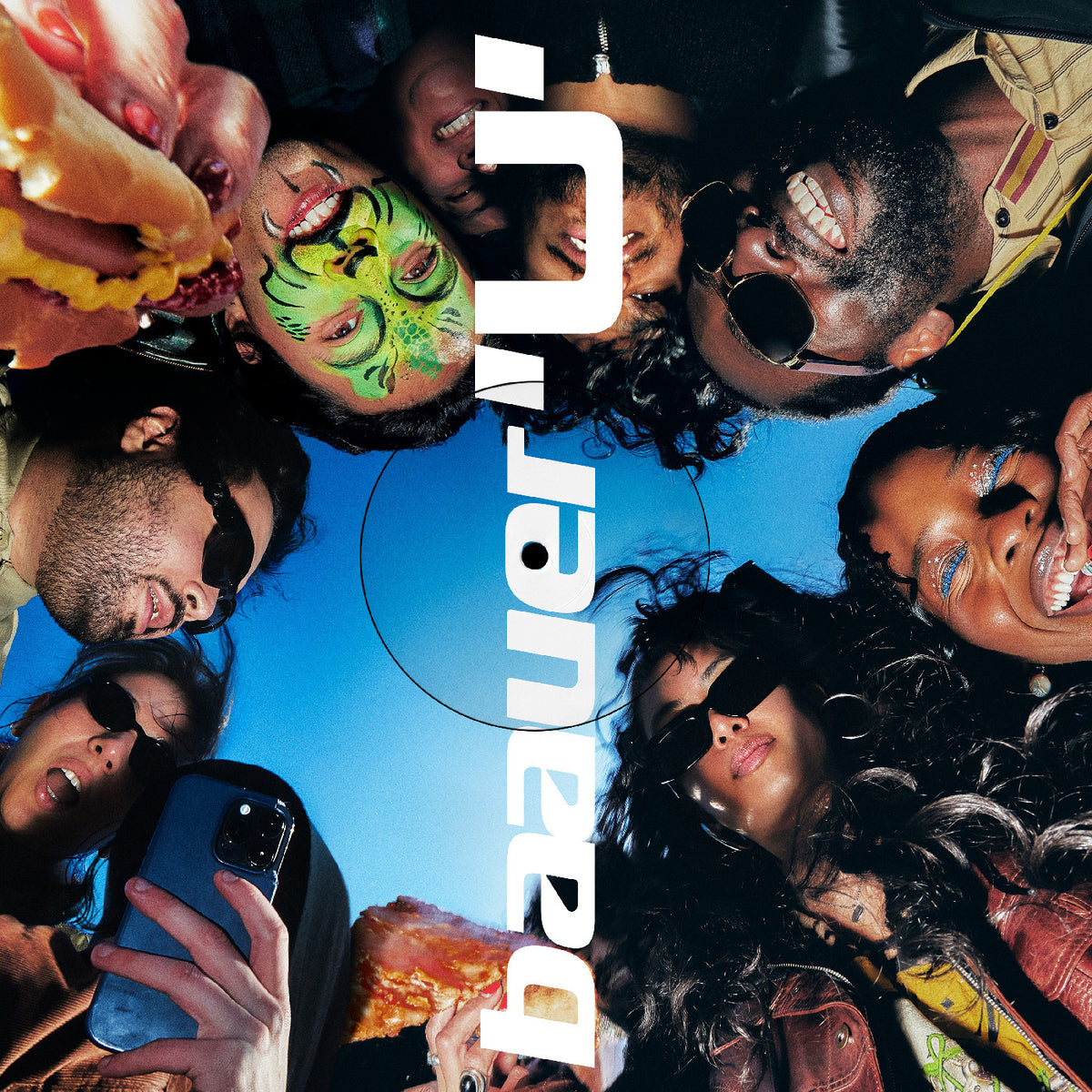 Group of people with colorful face paint and pizza, with 'Jian Diner' logo.