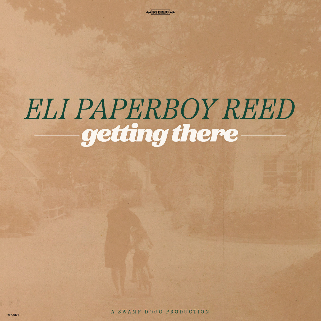 Album cover for 'getting there' by Eli Paperboy Reed with a sepia-toned scene of a person walking a dog.