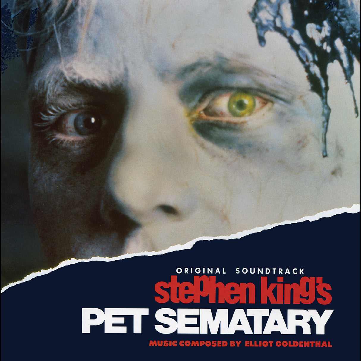 Cover art for the original soundtrack to Stephen King's Pet Sematary, featuring a close-up of a zombie-like face with one green eye and dark paint drips, with the title and composer credit on a dark blue torn-paper background.