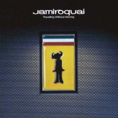 The image features the album cover of "Travelling Without Moving" by Jamiroquai, which is a 2LP record. The cover art displays a distinctive design with a silhouette of a figure against a vibrant yellow background, contained within a black record sleeve.