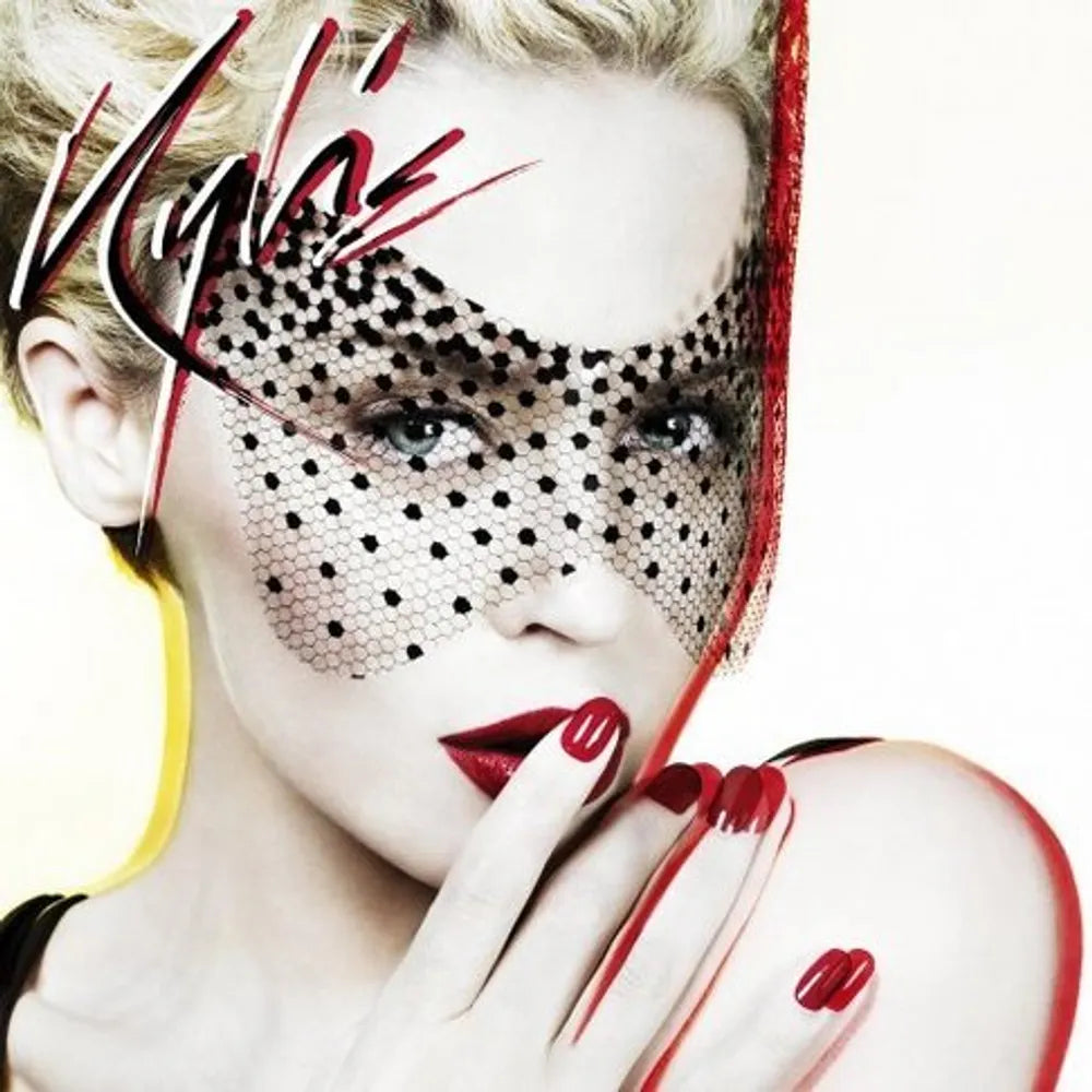 Model wearing a black and red face mask with 'KVD' branding, posing against a white background.