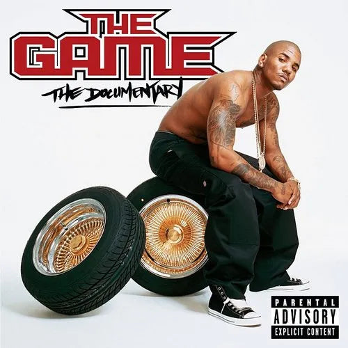 Album cover for 'The Game: The Documentary' with a person sitting on car wheels.