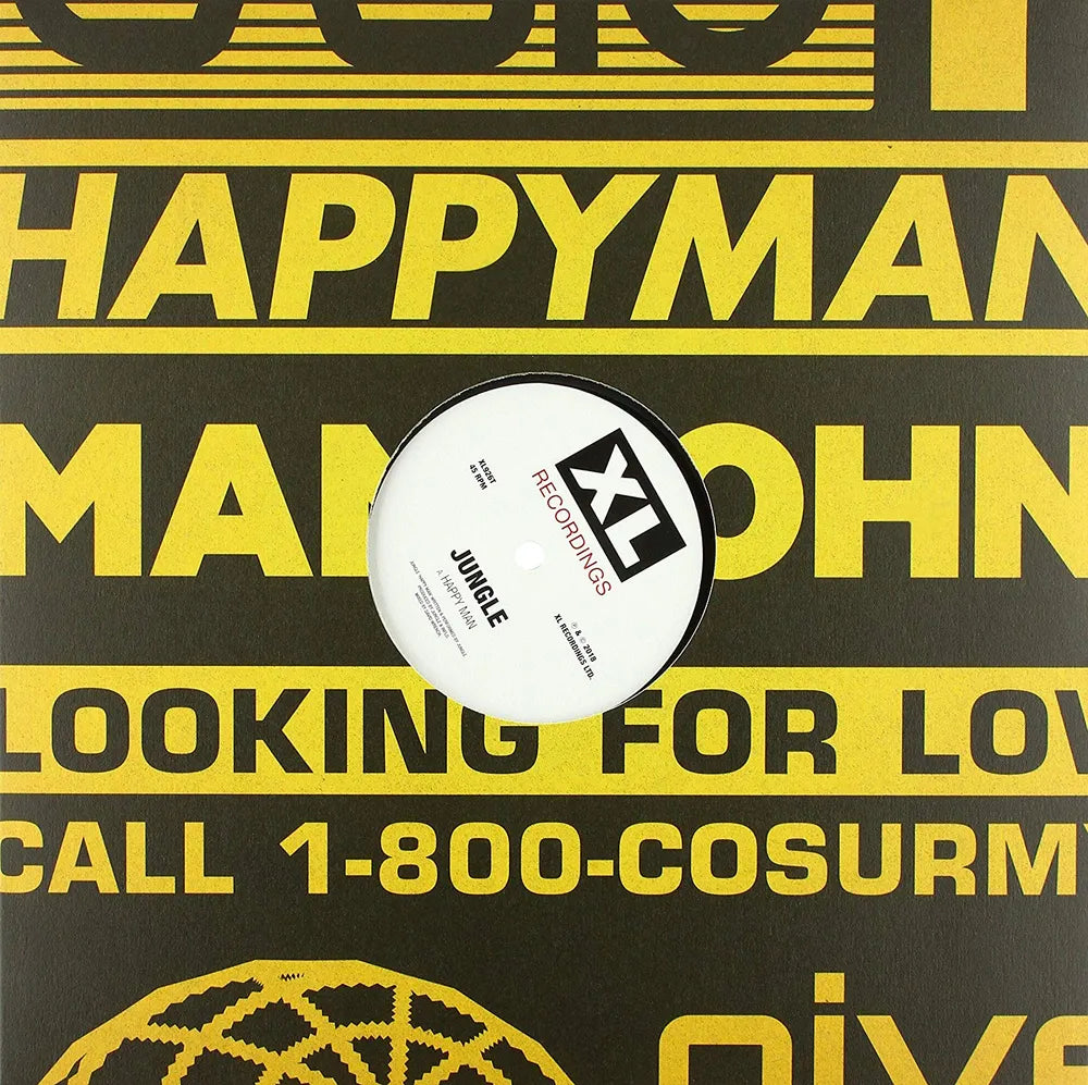 A white vinyl record with a black and white XL Records label sits centered on a black background printed with bold yellow text.