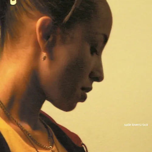 An album cover of Sade's 'Lover's Rock LP' featuring a close-up image of Sade Adupe in profile view.