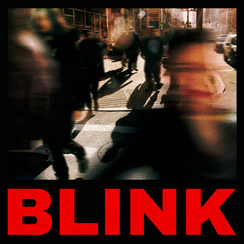 Blurred city street scene with people crossing a crosswalk, featuring the word 'BLINK' in red text.