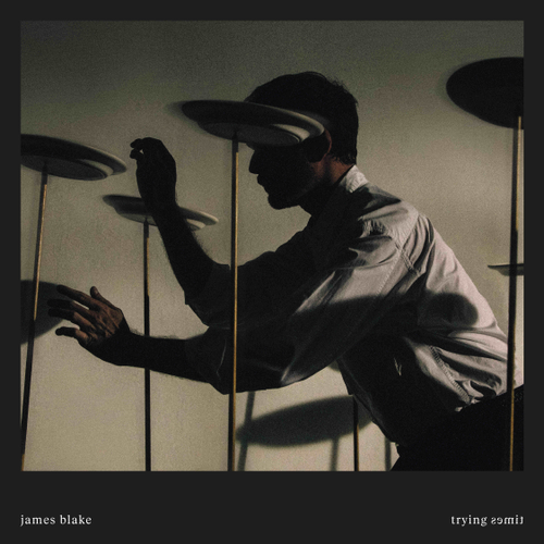 Album cover with a silhouette of a person interacting with shadows, featuring the artist 'James Blake' and album title 'Trying 2smile'.