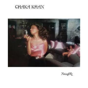 Album cover with a woman in a pink dress sitting on a couch, featuring the name Chaka Khan and the word 'Naughty'.