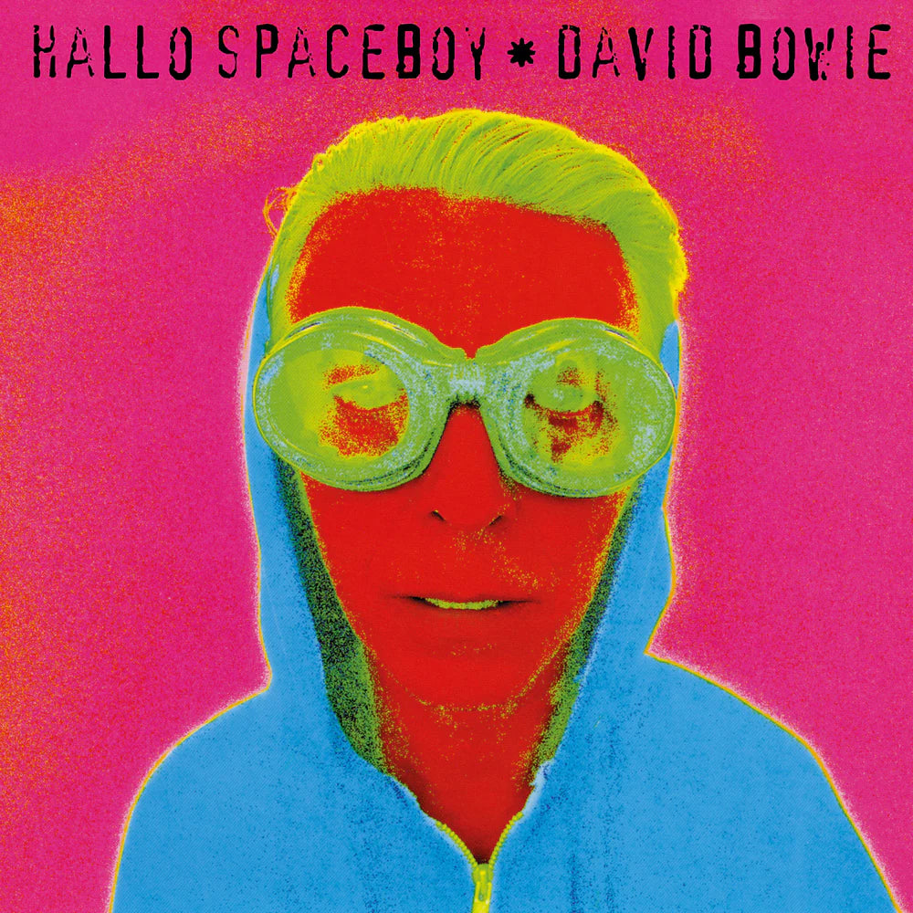 Album cover with a person wearing goggles and a colorful outfit against a pink background