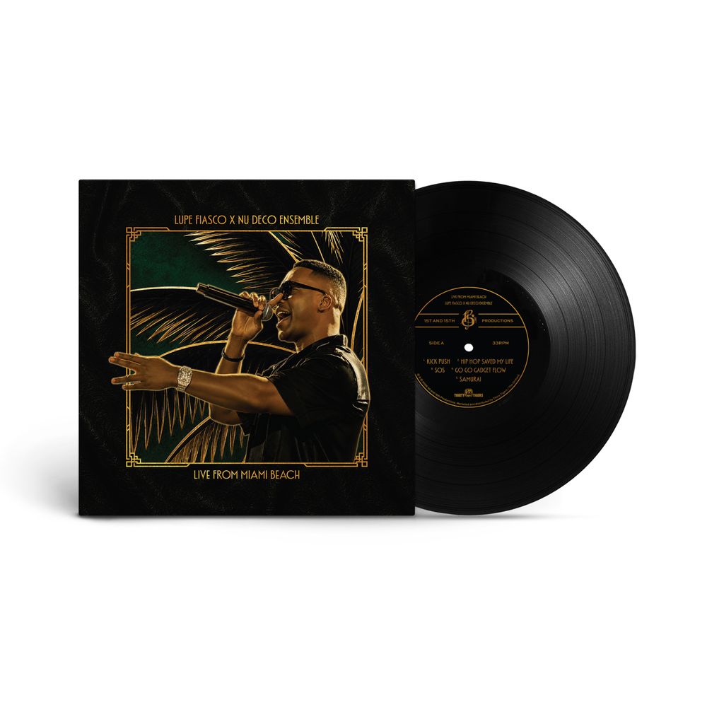 A vinyl record partially pulled from its sleeve on a clean white background. The sleeve and disc are black with gold text and a gold-framed portrait illustration of a man holding a microphone, with the title 'LIFE FROM HEATH BEACH' visible.