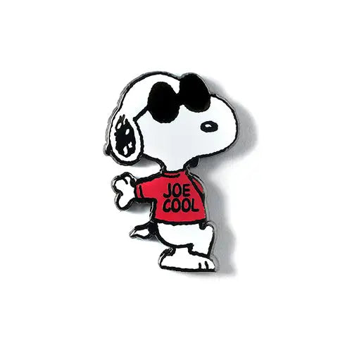 A pin badge featuring Snoopy from the Peanuts comic wearing a shirt that says 'JOE COOL'.