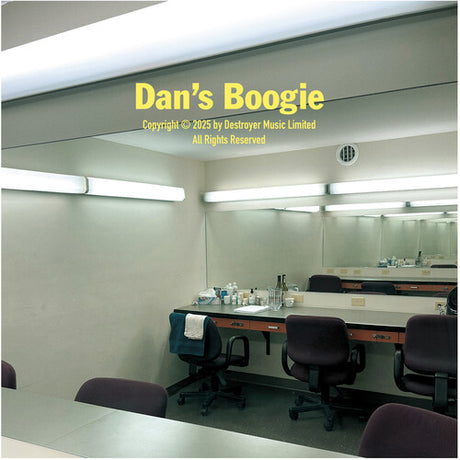 Cover image of the album 'Dan's Boogie' by Destroyer, showing a indoor setting with a desk and chairs, reflective surface, and the text of the album title and authorship.