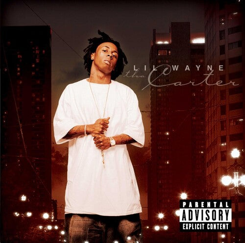 Album cover with a person in a white shirt against a cityscape background, featuring 'Lil Wayne The Carter' text.