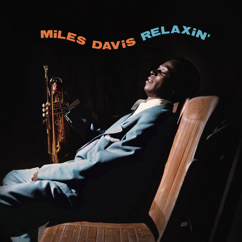 Album cover of 'Relaxin'' by Miles Davis featuring a person sitting with a trumpet.