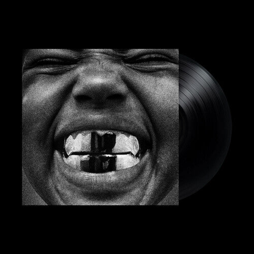 Vinyl record with a black and white image of a face on the cover