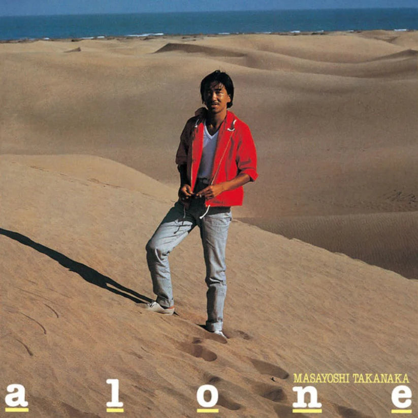 Album cover with a person standing on sand dunes, text 'alone' and 'Masayoshi Takanaka'.