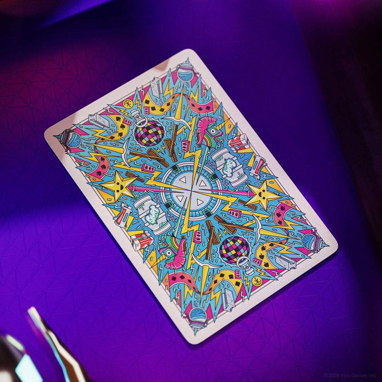 Colorful tarot card with intricate design on a purple surface