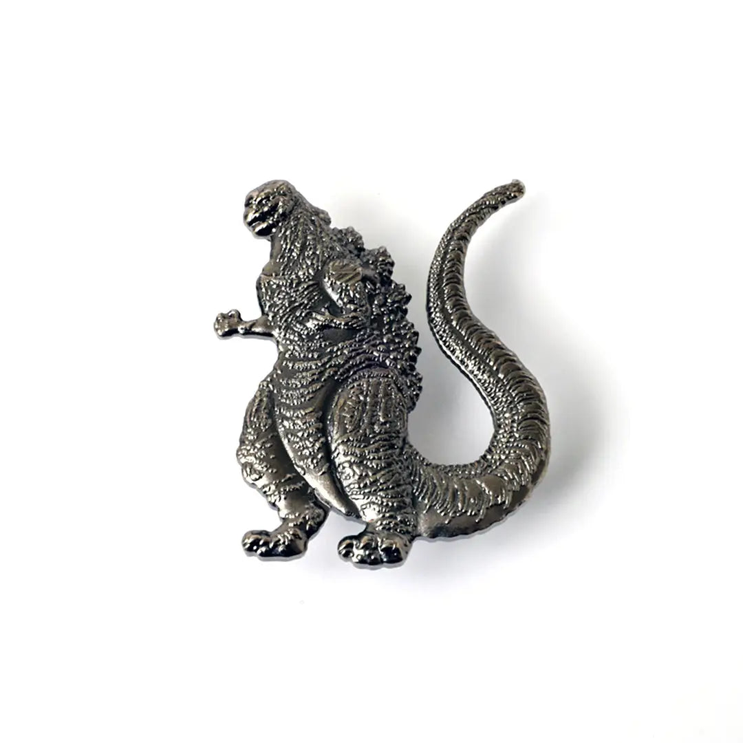 Metallic Godzilla figurine on a white background