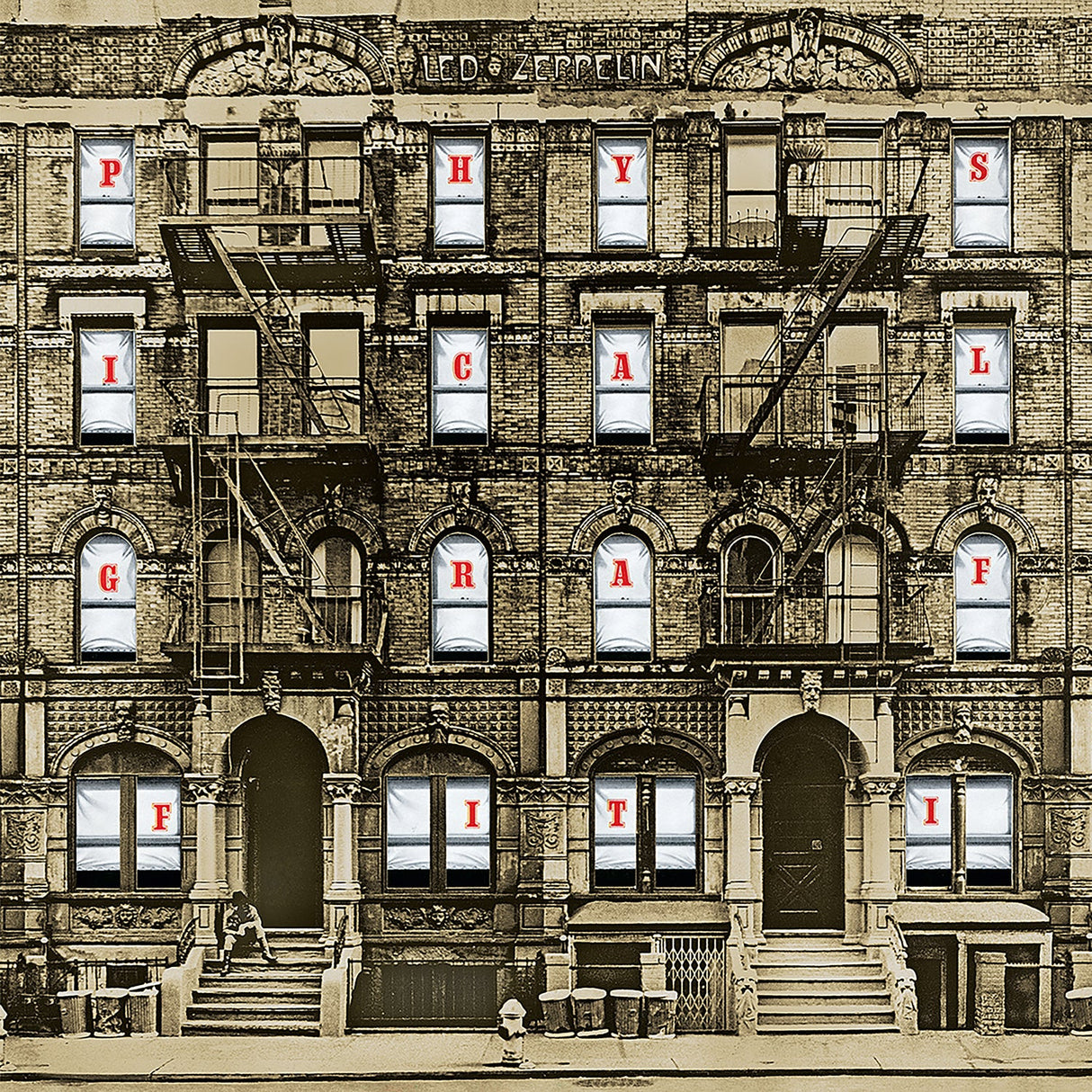 Album cover of 'Physical Graffiti' by Led Zeppelin with building facade and window panes displaying letters.