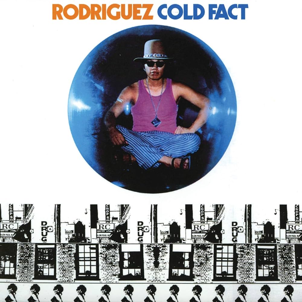 Album cover with a person in a purple tank top and hat, surrounded by text and building silhouettes.