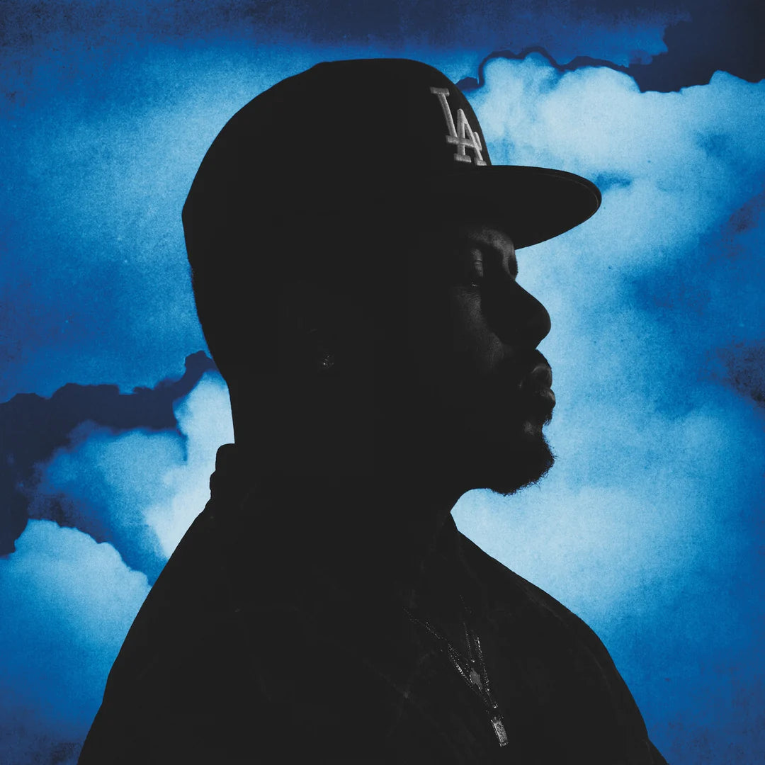 Album cover featuring a silhouette of a person wearing a cap against a blue backdrop with clouds.