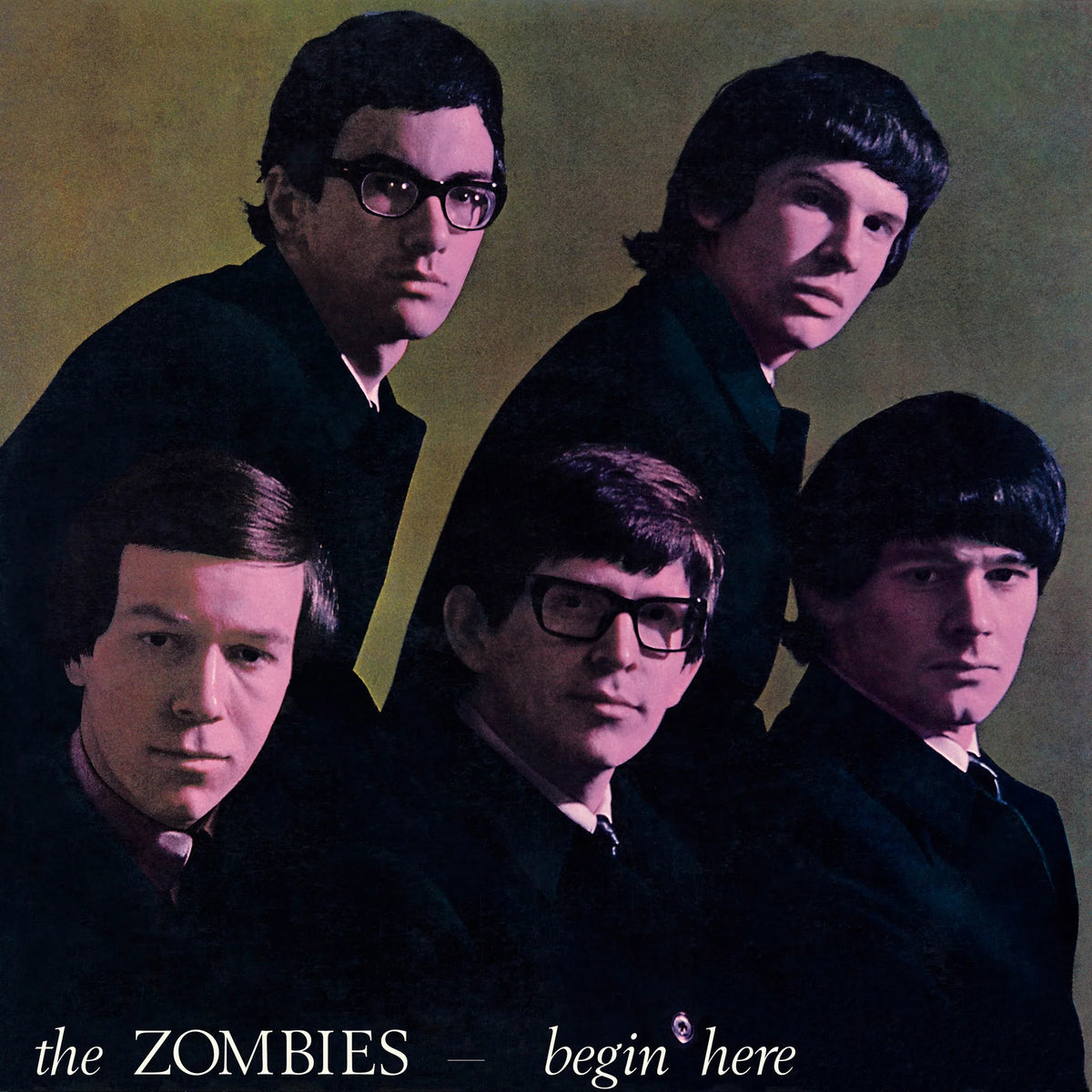 Album cover art for 'the ZOMBIES - begin here' featuring four men in dark suits against a muted olive-yellow background.