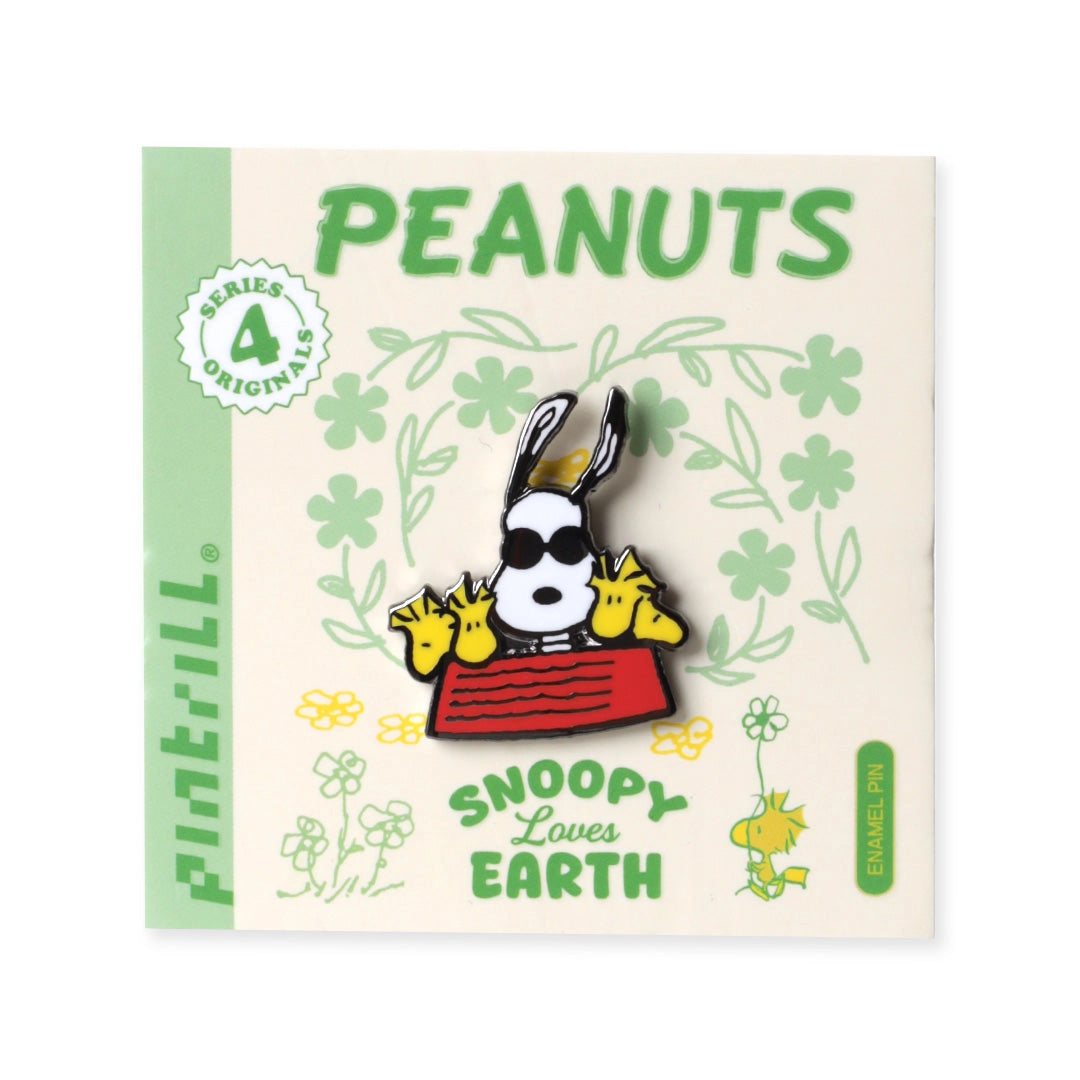 Peanuts-themed pin with Snoopy on a decorative card
