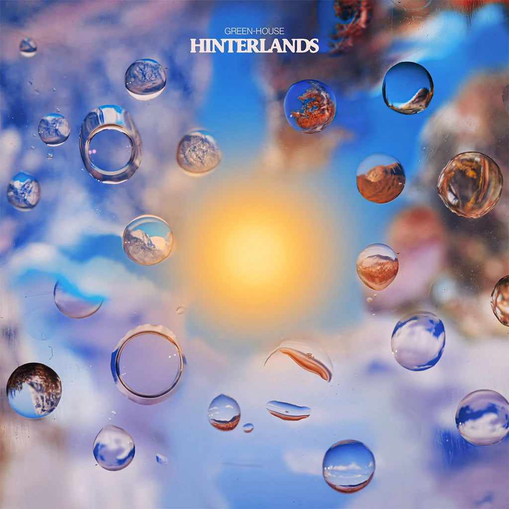 Album cover with water droplets on a glass surface and 'Green House Hinterlands' text.