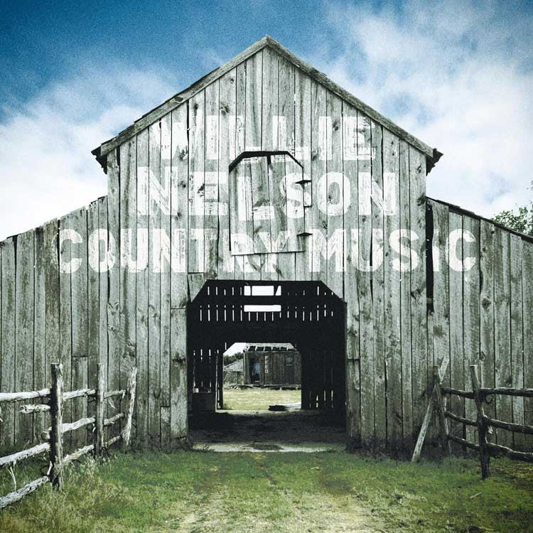 Wooden barn with text overlay on a blue sky background