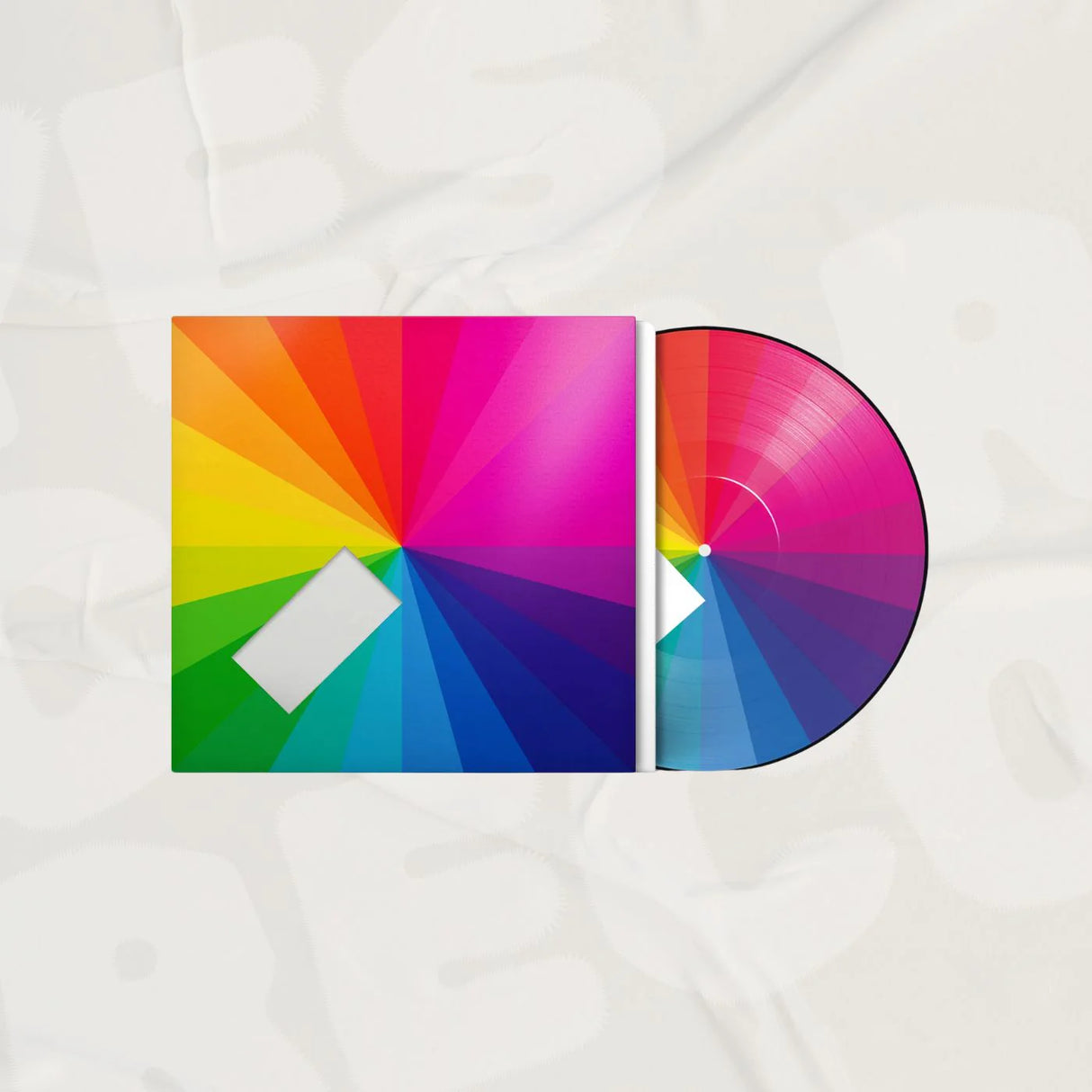 Colorful vinyl record and cover on a white background