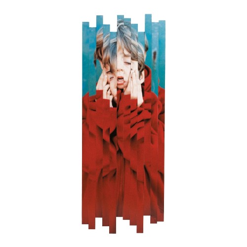 Person wearing a red coat with a blue background