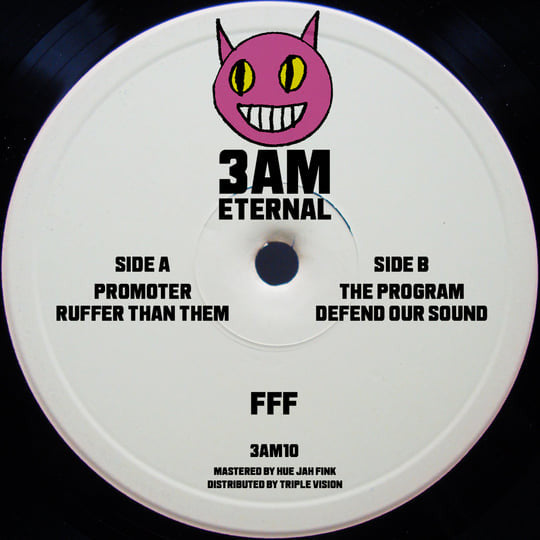 Vinyl record label with a cartoon character and text on a black background