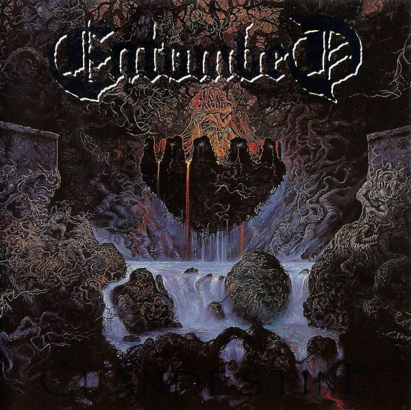 Album cover with a dark, mystical landscape and a prominent logo at the top.