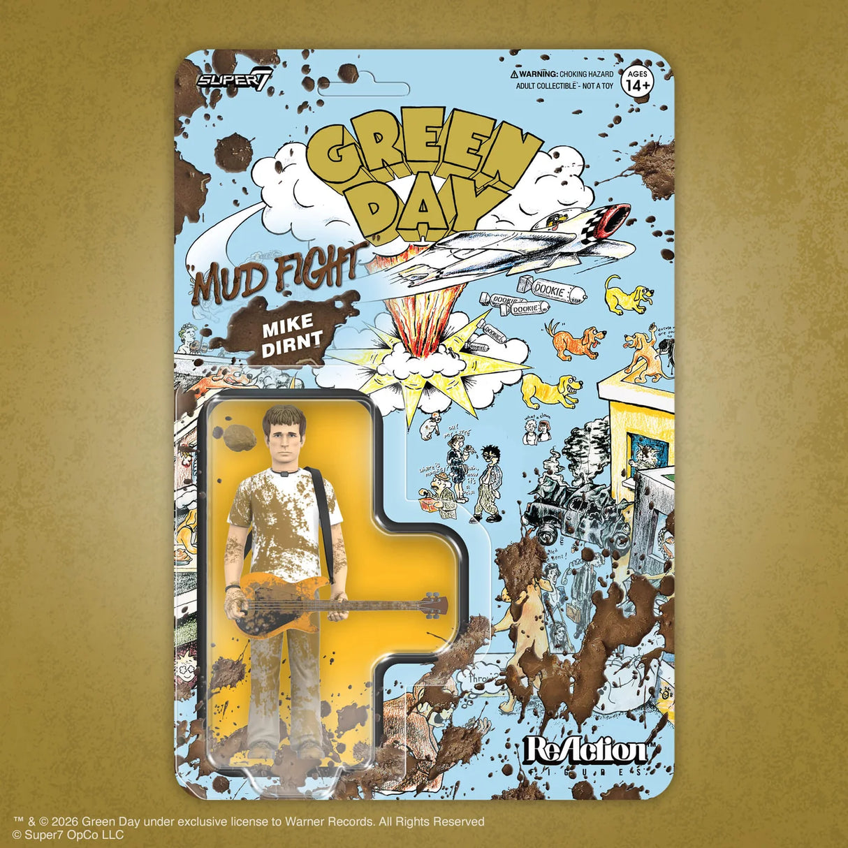 A Green Day 'Mud Fight' Mike Dirnt action figure in its original illustrated blister packaging, displayed against a textured gold background.