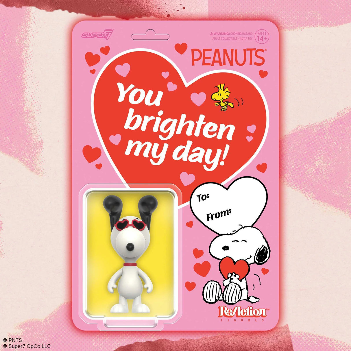 Peanuts-themed product packaging with a heart and character illustration on a pink background
