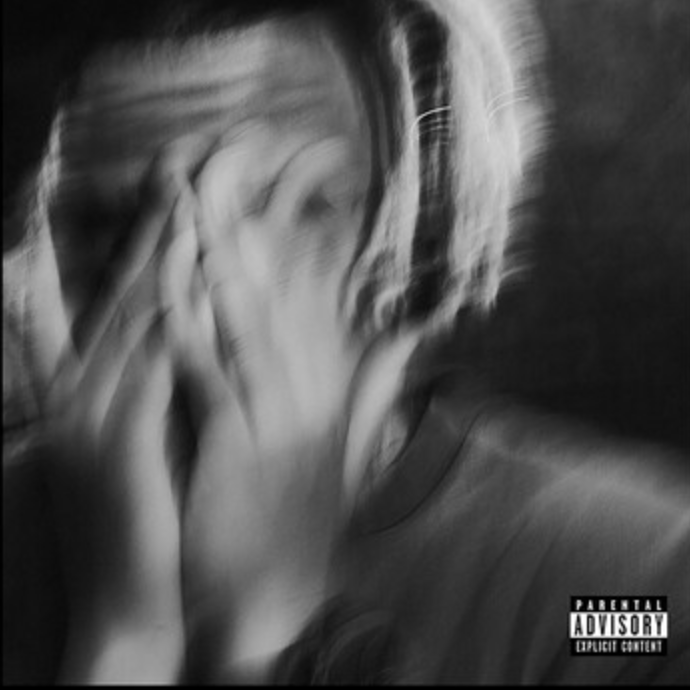 Black and white album cover featuring a blurred image of a person covering their face with their hands. There is a 'Parental Advisory' label on the image.