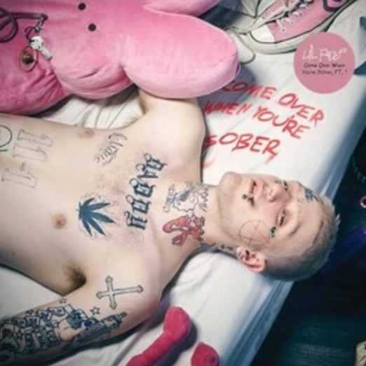 This image is a cover art for the album "Come Over When You're Sober Part 1" by Lil Peep. It features a person lying down with a collection of tattoos visible, surrounded by objects like a pink heart-shaped cushion and a stuffed toy.