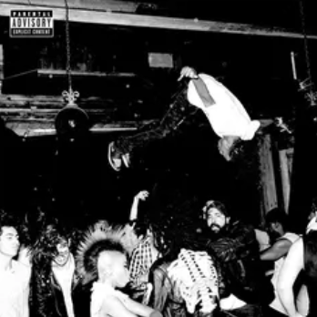 Black and white photo of a concert with a performer on stage