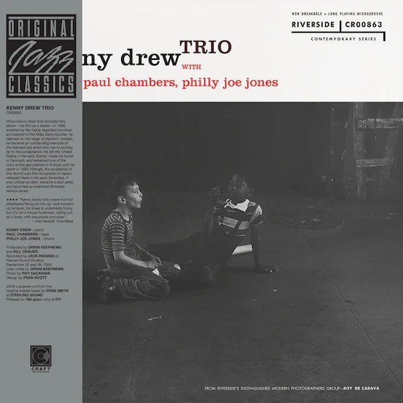 Album cover of Kenny Drew Trio featuring two people sitting on a floor with text and logos.