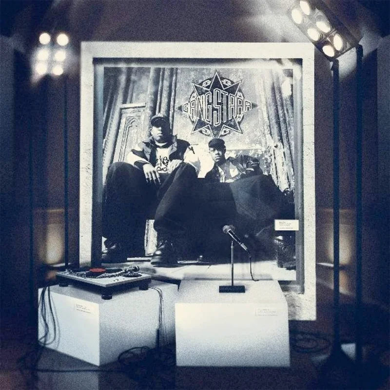 Studio setup with a portrait of two individuals and a 'Gang Starr' album cover.