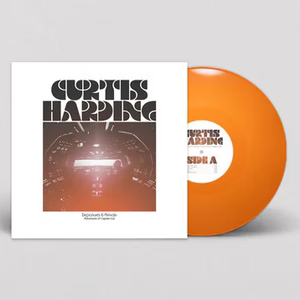 Vinyl record with orange disc and white cover featuring 'Curtis Harding' on a gray background