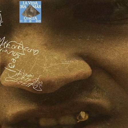 Album cover with text and a small square section showing a fish.