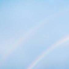 Partial rainbow in a blue sky