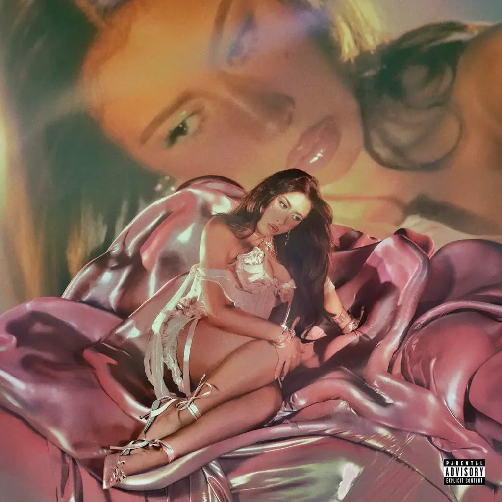 Album cover with a person in lingerie sitting on a large pink flower, with a blurred face in the background.